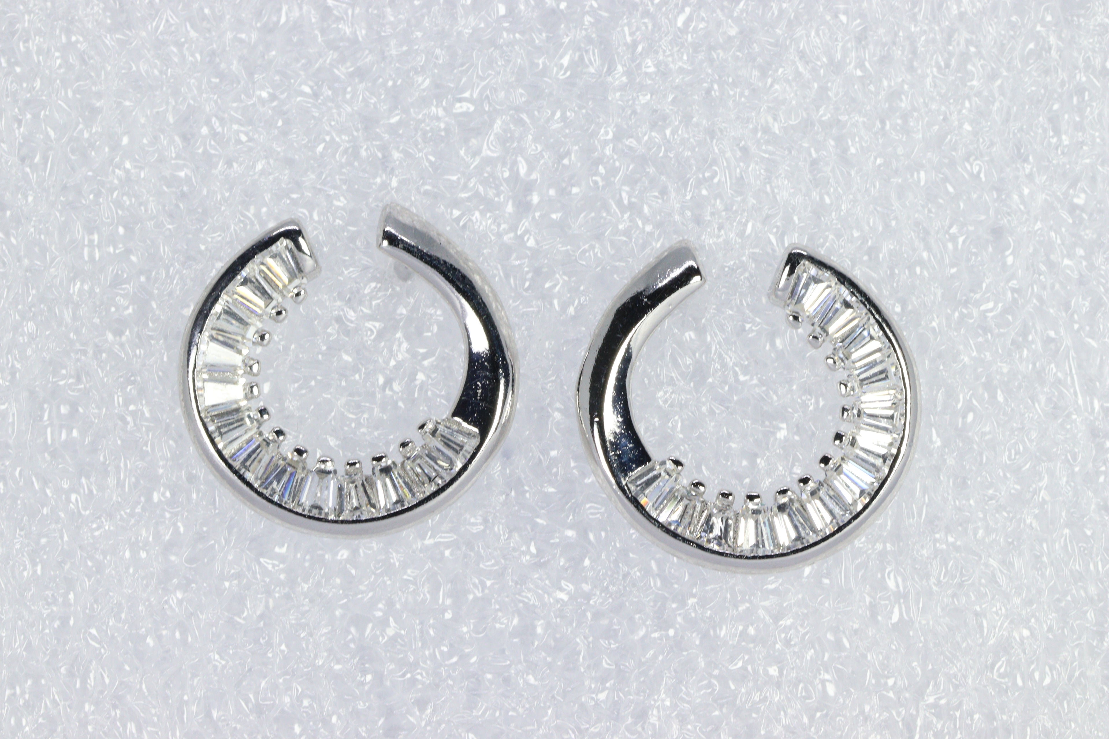 Twinkling Curve Silver Baguette Studs